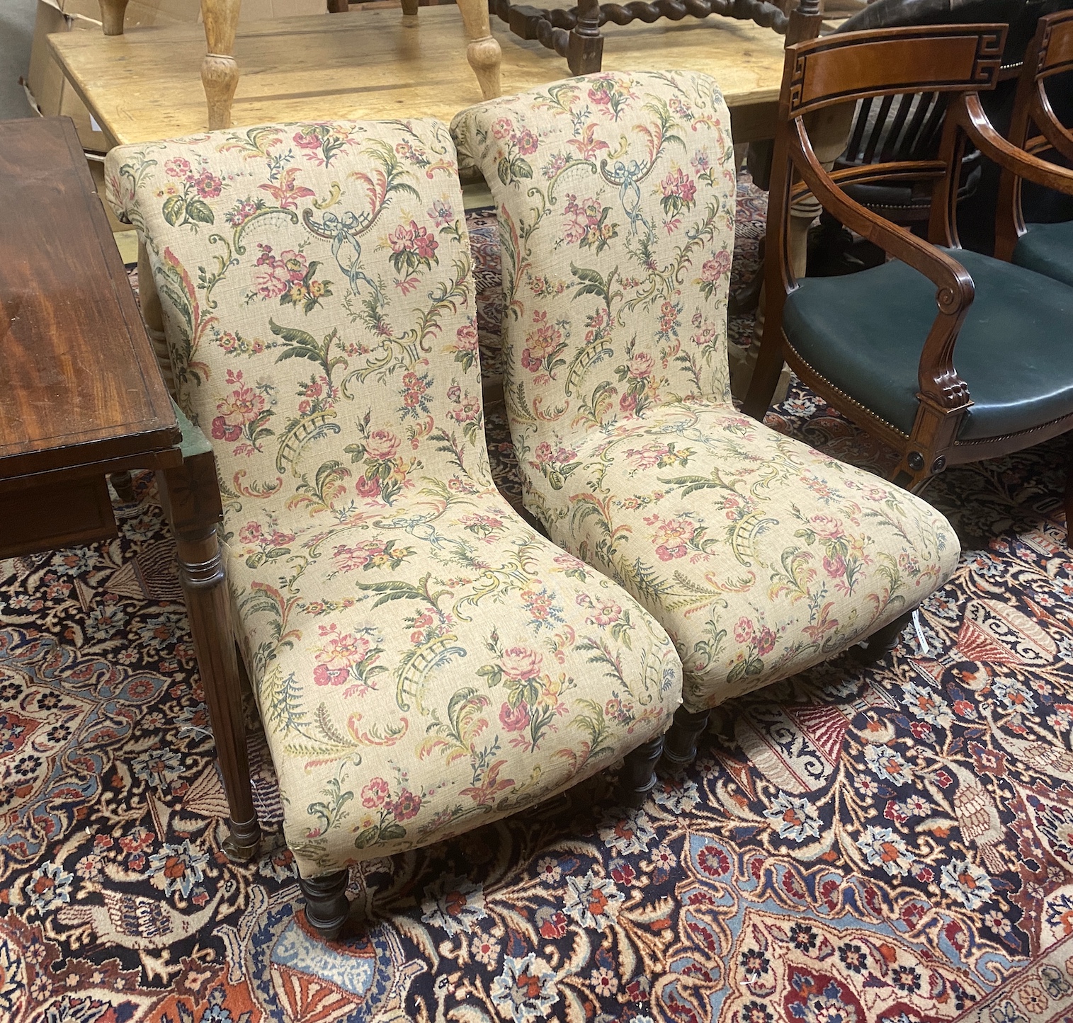 A pair of Victorian scroll frame nursing chairs, width 50cm, depth 65cm, height 79cm